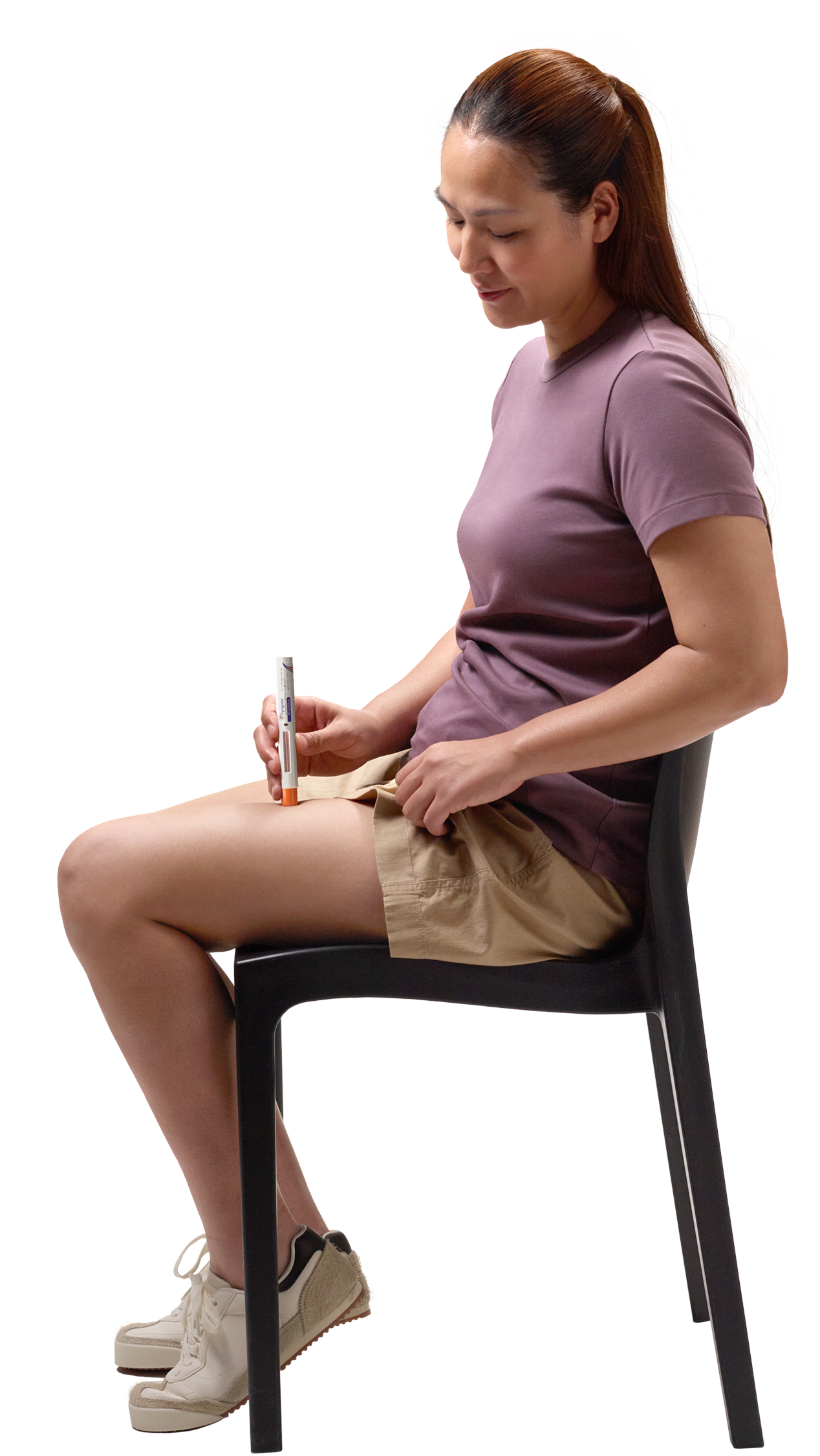 Actor portrayal of patient sitting while self-administering TRYNGOLZA