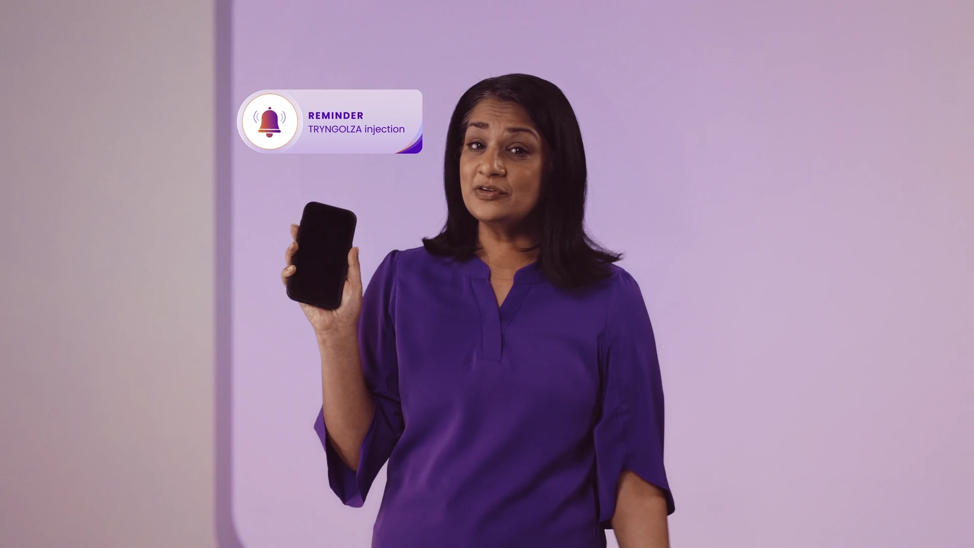 Woman holding a phone to set a calendar reminder
